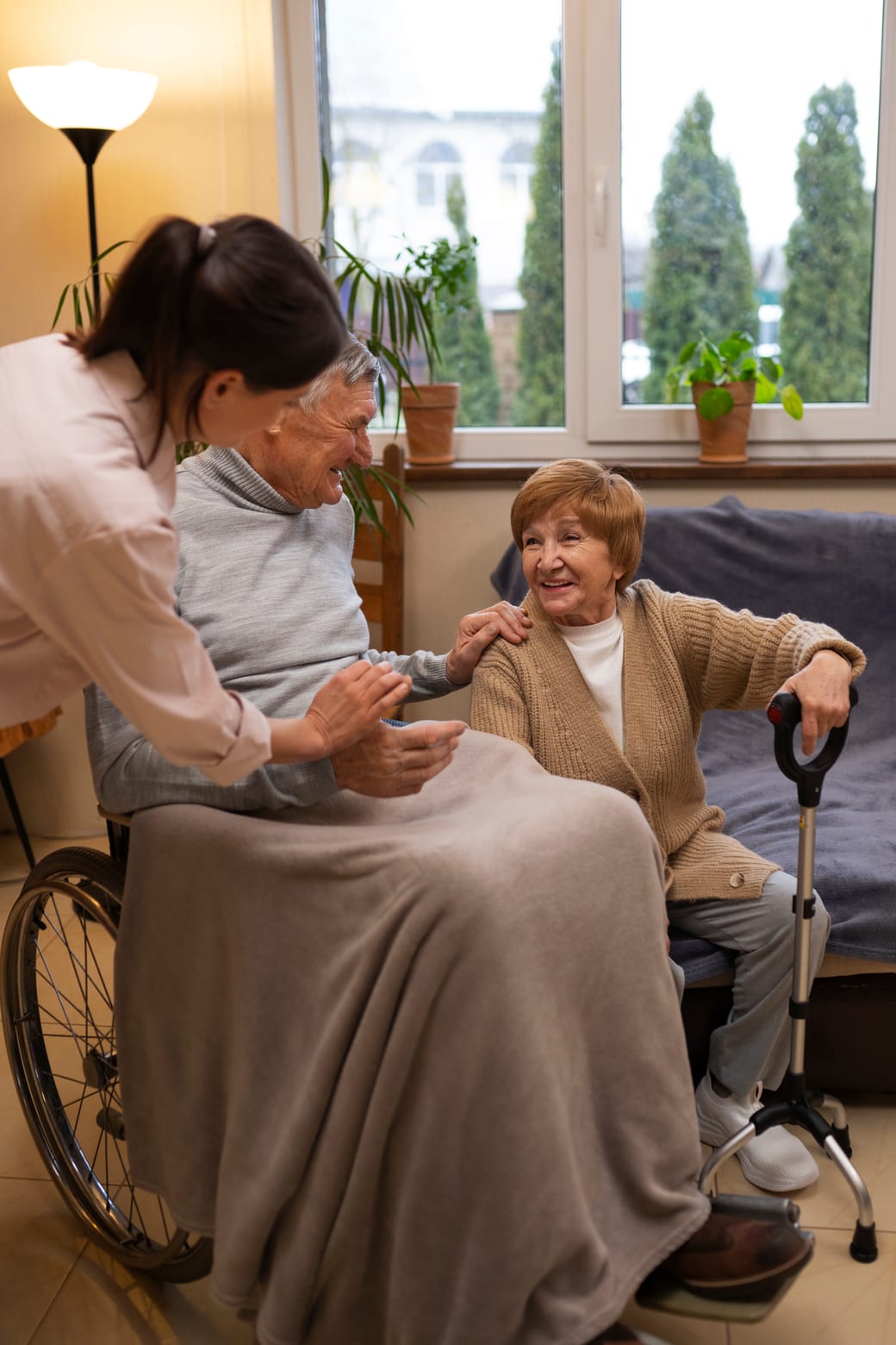 Warm caregiver assisting an elderly woman at home in Worcester, Massachusetts